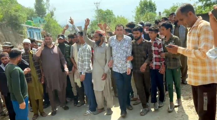 People protest after death of minor girl with shooting stone on road in Budhal area on Saturday. —Excelsior/Imran