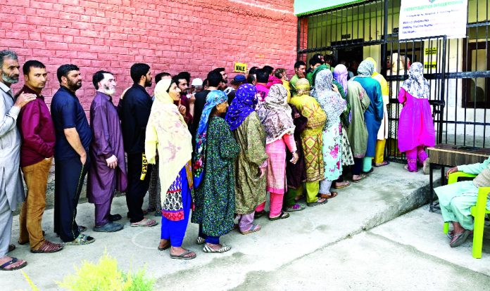 Long queue of voters at Imam Sahab, Shopian on Saturday. More pics on page Nos 3, 5 & 9. -Excelsior/Younis Khaliq