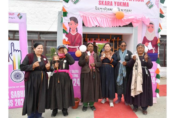 Female voters showing mark of indelible ink after casting their votes in Skara Yokma, Leh on Monday.