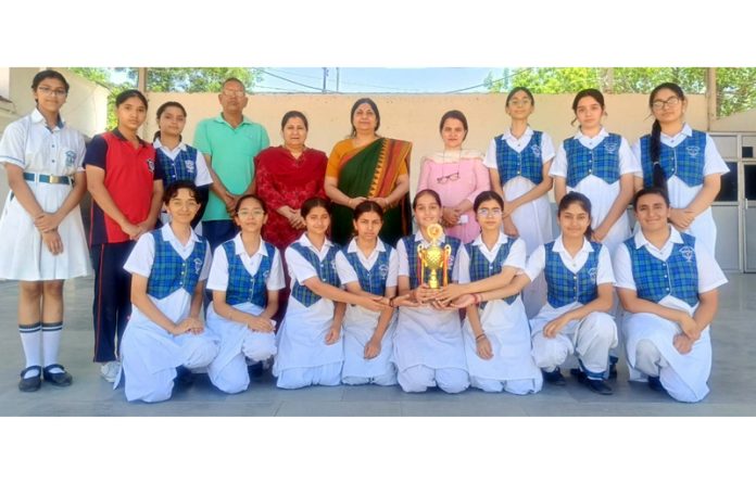 DPS girl's team displaying trophy along with school staff.