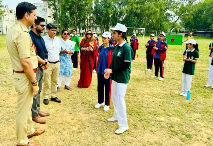 Dignitaries interacting with players during a friendly match at Jammu.