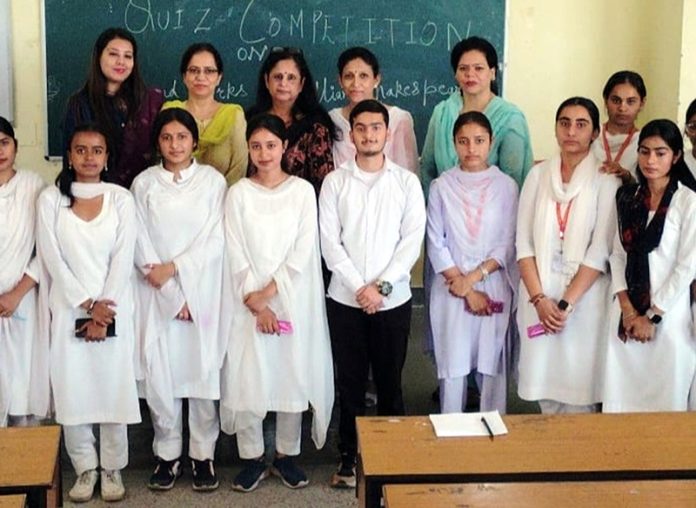 Participants posing for photograph with Principal and staff members.