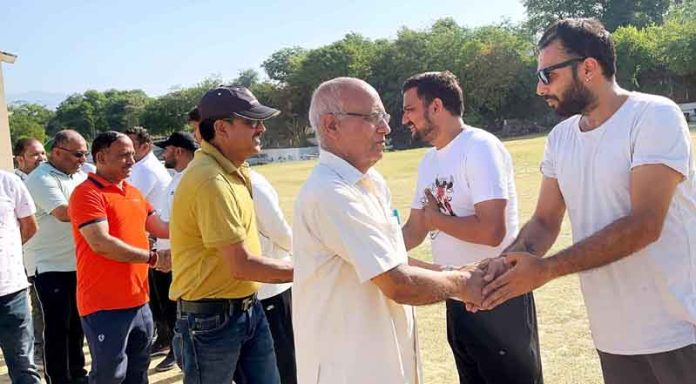 Guests interacting with players before a match at DPS Ground, Udhampur.