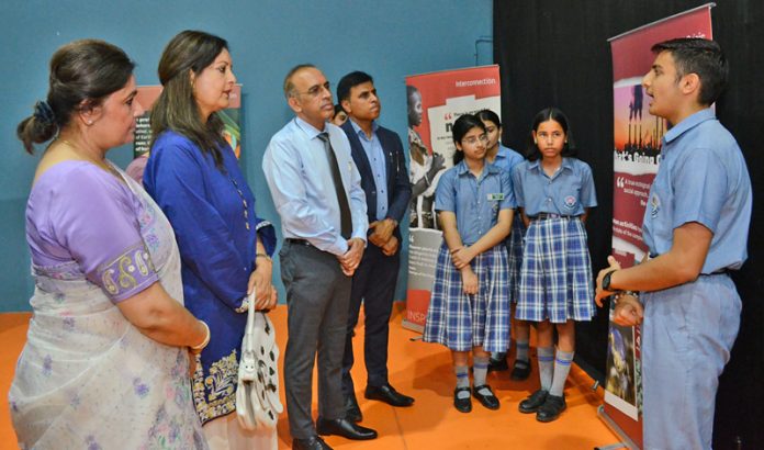 Arti Choudhary, MD of KC Public School interacting with students during an exhibition in Jammu on Wednesday.