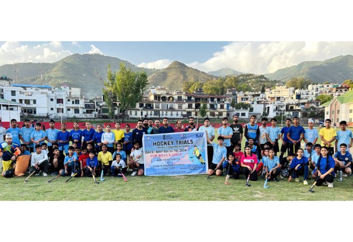 Hockey players posing during two day selection trials at Poonch along with dignitaries.