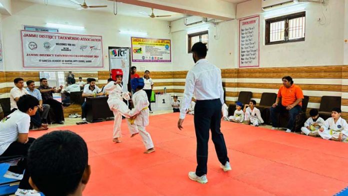 Taekwondo players in action during District Championship at Jammu.