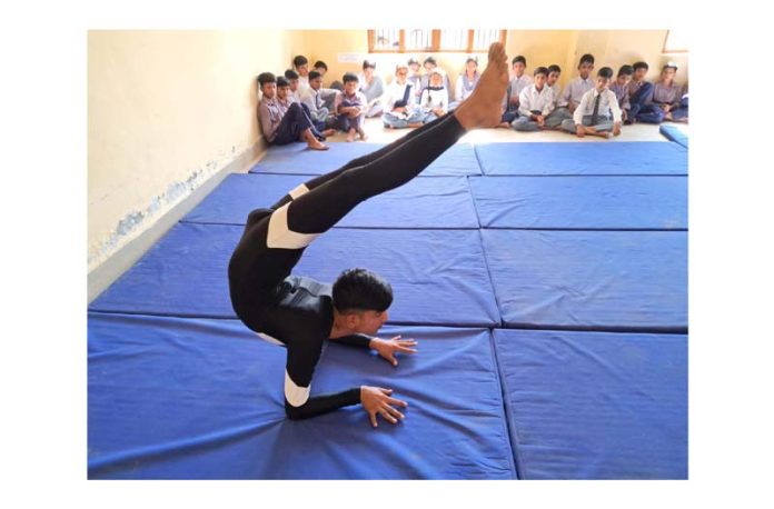 A boy displaying Yoga activity during Inter-School Zonal Level Tournament in Kathua.