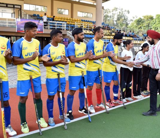 Dignitaries interacting with hockey players during a match on Thursday.
