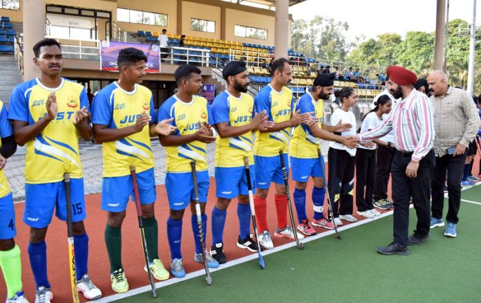 Dignitaries interacting with hockey players during a match on Thursday.