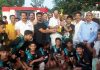 BJP leader and former Minister Surjit Singh Slathia presenting trophy to a winning team.