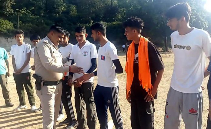 SHO Samba Sandeep Charak interacting with players during a cricket tournament at Samba on Sunday.