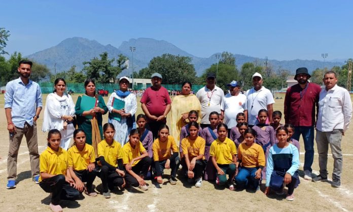 Players posing along with dignitaries during Inter-school competitions at Reasi.