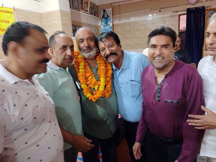 Kamal Krishan along with others posing for a photograph after elected as SD Sabha Sopore Camp president.