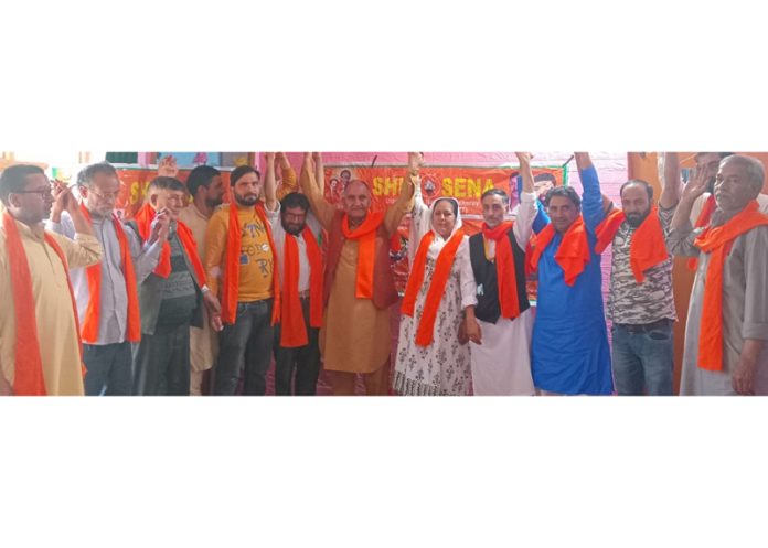 A group of people poseing for a photograph with others after joining Shiv Sena in Srinagar on Tuesday.