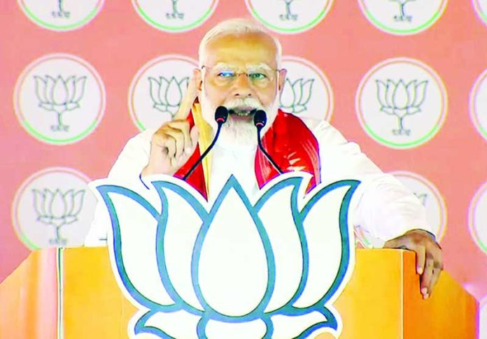Prime Minister Narendra Modi at a public meeting ahead of Lok Sabha polls in Berhampur, Odisha on Monday.(UNI)