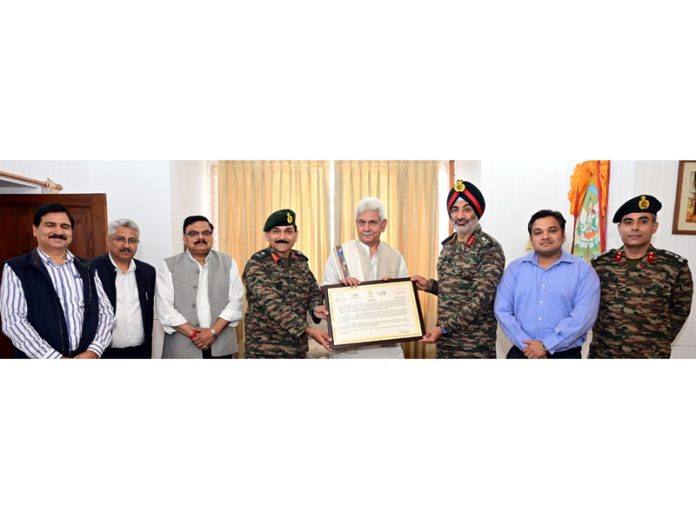 LG Manoj Sinha meeting with Lt Gen Gurbirpal Singh and others at Raj Bhawan on Friday.