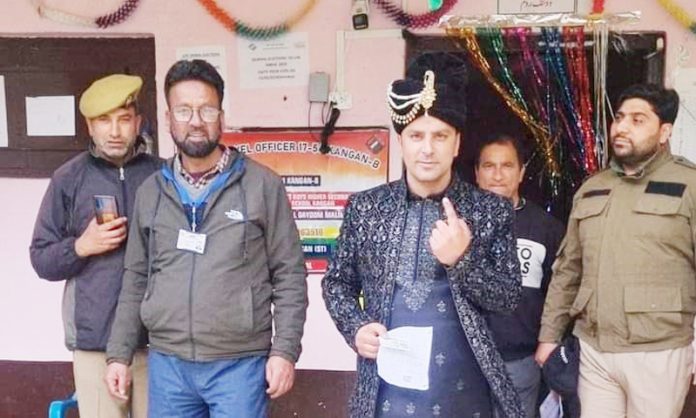 A groom after casting his vote at Kangan in Ganderbal district.— Excelsior/Firdous