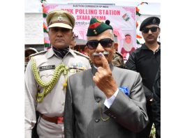 Lieutenant Governor of Ladakh, B.D. Mishra showing mark of indelible ink after casting his vote at a polling booth in Leh on Monday.