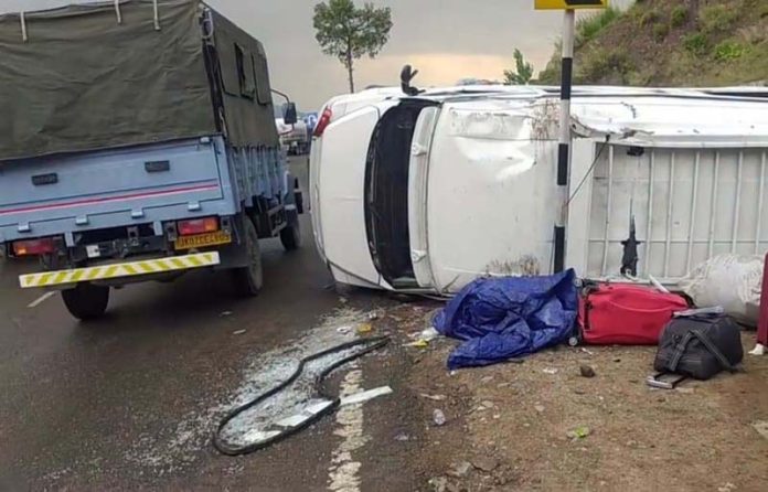 The tempo traveller which overturned near Chanderkote on Jammu-Srinagar NH on Thursday.