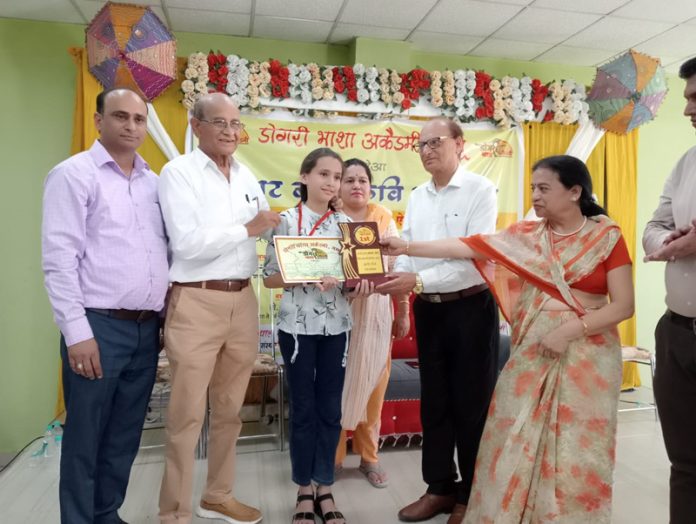 Guests awarding winner during Virat Bal Kavi Sammelan by Dogri Bhasha Academy.