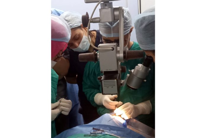 Doctors performing eye transplantation procedure on a patient at GMCH Jammu.