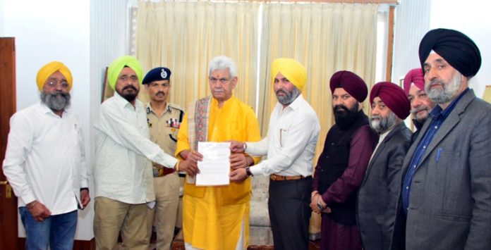 LG Manoj Sinha meeting with Sikh Coordination Committee Chairman Ajit Singh on Thursday.