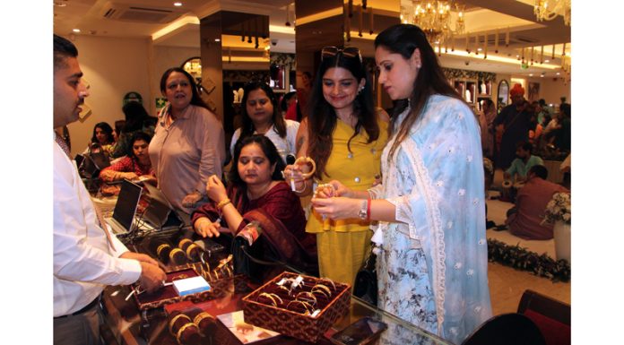 Women making purchases at the newly opened store of Tanishq in Jammu on Friday. -Excelsior/Rakesh