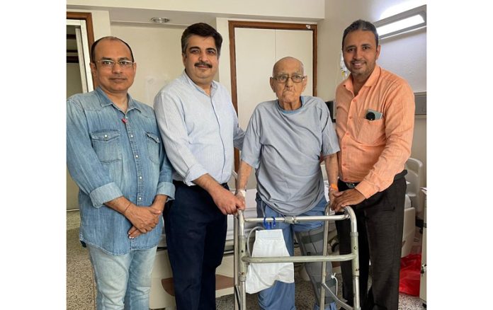 Dr Mohit Arora posing with a patient and his attendant at Fortis Hospital, Amritsar.