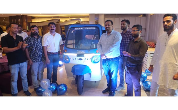 MD Astro India Vikram Mahajan and other staff on the launch of metal bodied e-auto 'Treo Plus'.