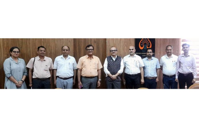 Dr Chintan Vaishnav with others during visit to SMVDU.
