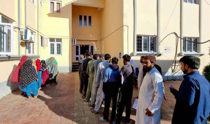 Voters waiting for their turn outside a Polling Station in Uri.—Excelsior/Aabid Nabi