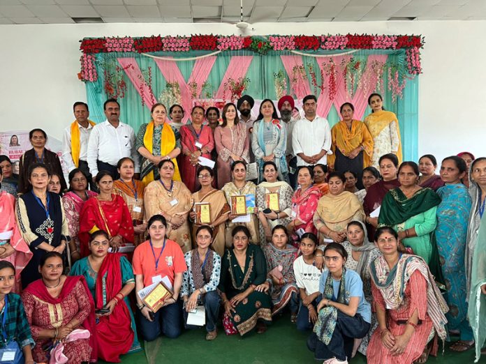 Participants of Rural Women Conclave organised at RS Pura posing for a group photograph.
