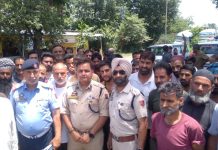 SSP Traffic NH Rohit Baskotra with drivers at Udhampur on Saturday.