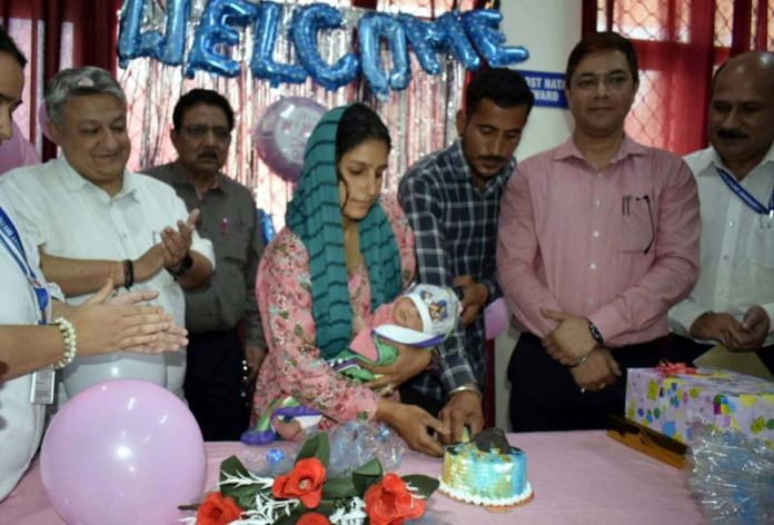 Reasi admn celebrating birthday of new born girl child.