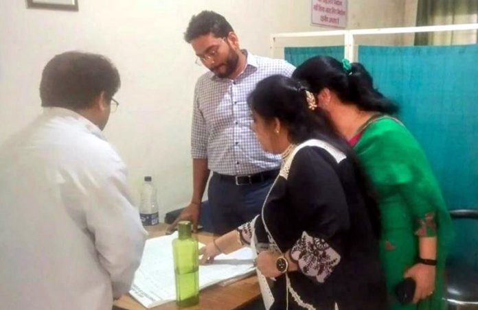 DC Jammu inspecting hospital record on Wednesday.