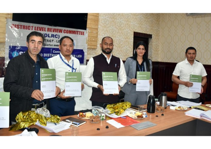 District Development Manager, NABARD Leh along with DC Leh and others displaying the booklet of Potential Linked Credit Plan 2024-25.