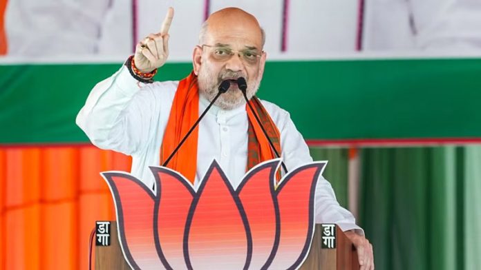 Union Minister and BJP leader Amit Shah addressing public rally at Karnataka on Friday.