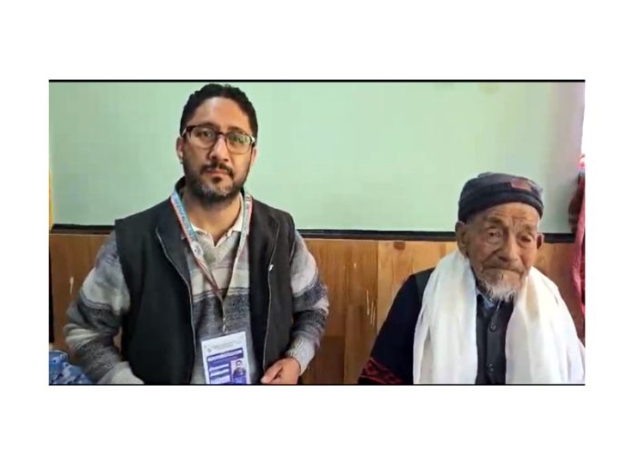 ARO Postal Kargil with centenarian voter Haji Yousuf who cast his vote through Postal Ballot. -Excelsior/Basharat Ladakhi