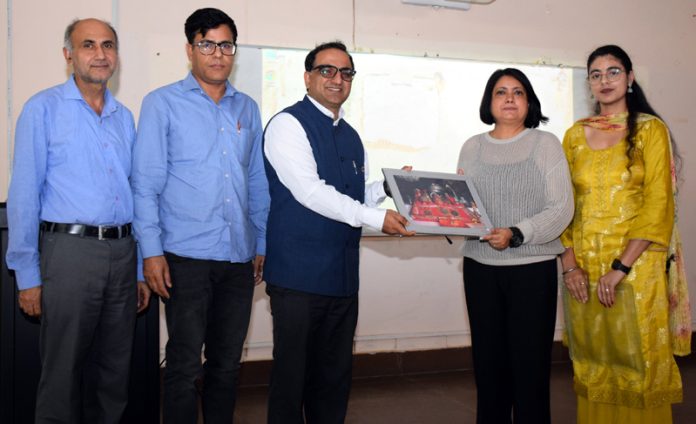 Memento being presented to the guest in awareness programme at SMVDU.