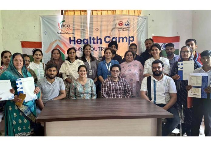 Teams of FICCI FLO JKL and Narayana Hospital along with others during a health camp at Purkhoo on Wednesday.