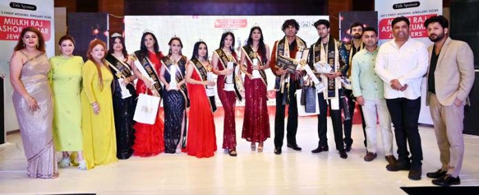 The winners of Mr, Mrs and Miss J&K 2024 contest posing for a group photograph in Jammu on Monday.