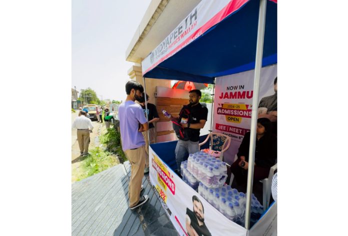Drinking water served to the students at a drinking water booth installed by PW in Jammu.