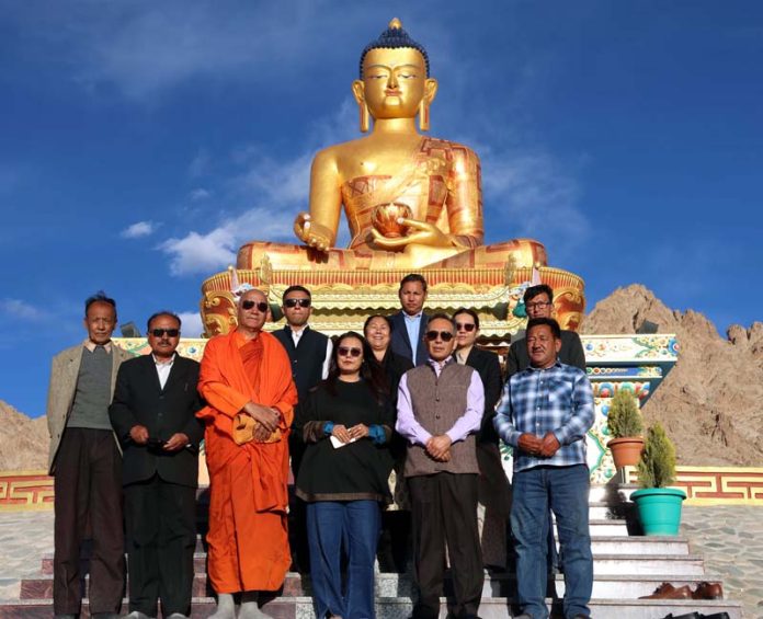 Justice Tashi Rabstan posing along with others during a function organised at MIMC, in Ladakh on Wednesday.