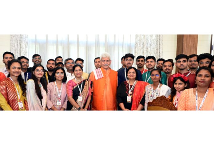 LG Manoj Sinha posing for a group photograph with youth delegation from Maharashtra on Tuesday.