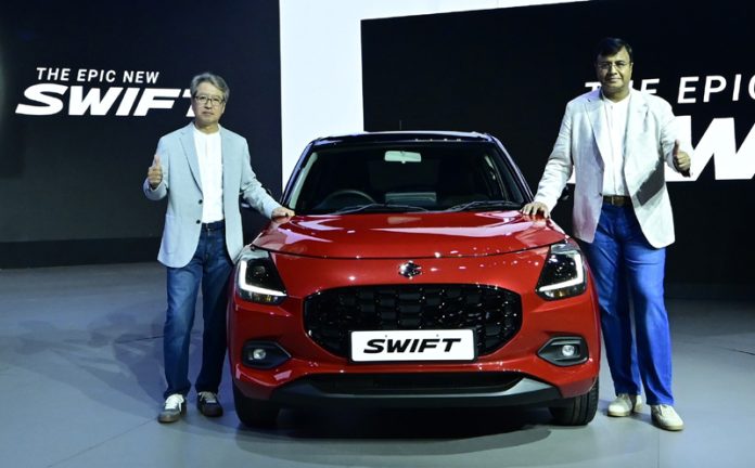 Hisashi Takeuchi, MD and CEO, MSIL, launching new Swift in a function held on Thursday.