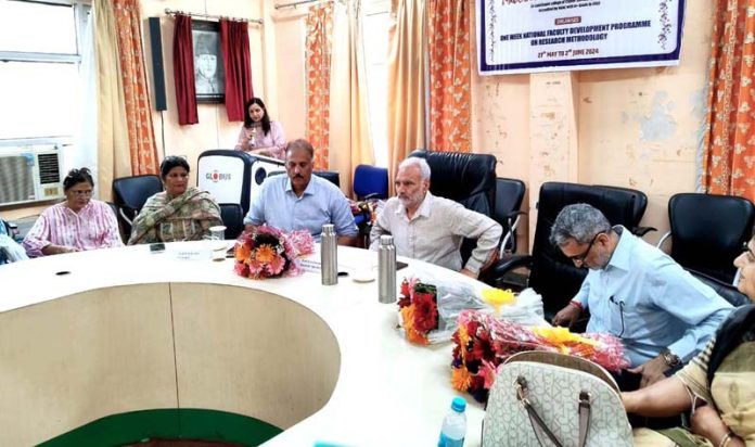 Dignitaries during the inaugural session of one week Faculty Development Programme (FDP) at MAM College Jammu on Monday.