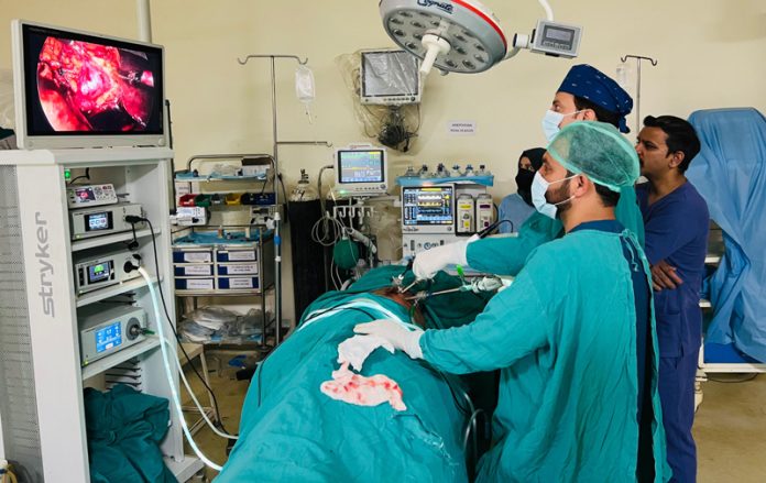 A team of doctors performing surgery at GMC Rajouri.