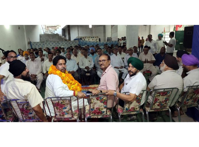 JKPCC working president Raman Bhalla addressing workers’ meeting at Bhour Pind on Friday.