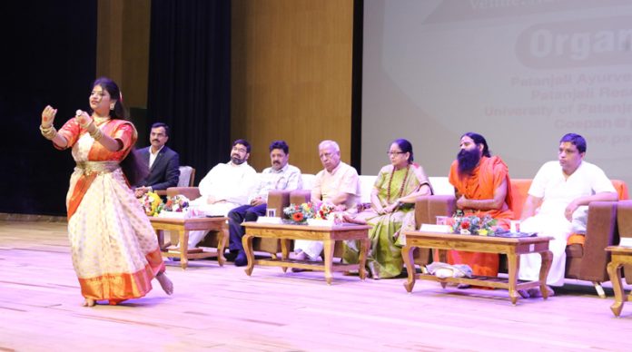 Yog Guru Baba Ramdev along with Acharya Balkrishan and others during a function at Haridwar on Thursday.
