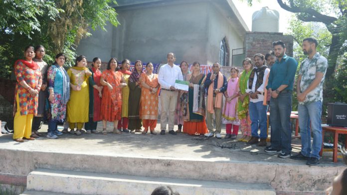 Singers, actors and musicians of BLSKS posing together after presenting a musical play.
